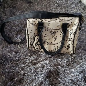 Beige music notes purse